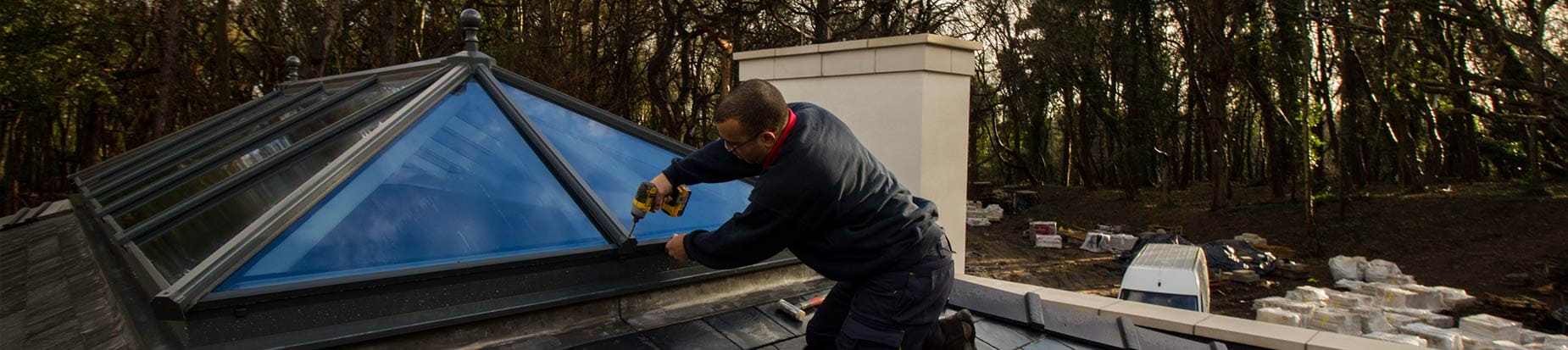 Picture of one of our installers Carl fitting one of our top of the range aluminium roof lanterns.