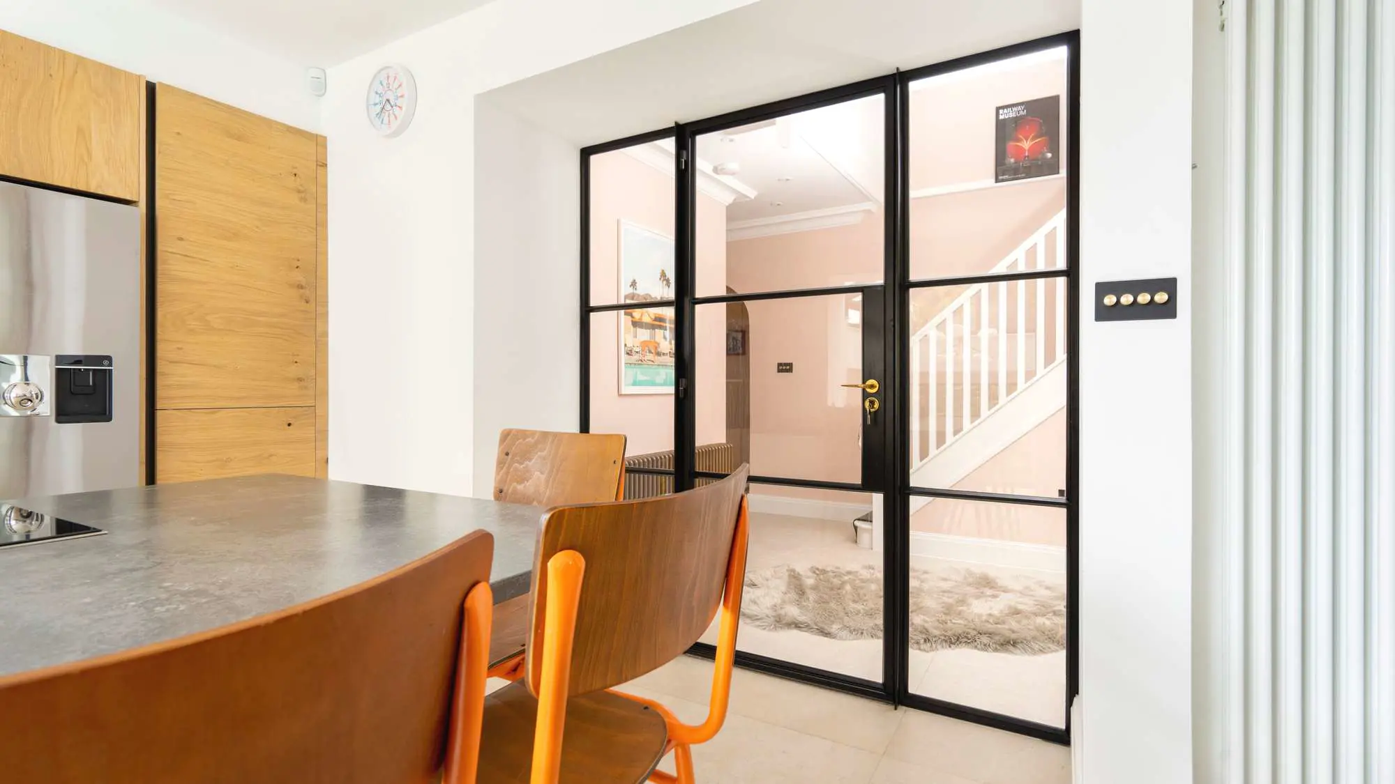 Internal Crittall screen separating the kitchen and hall areas.