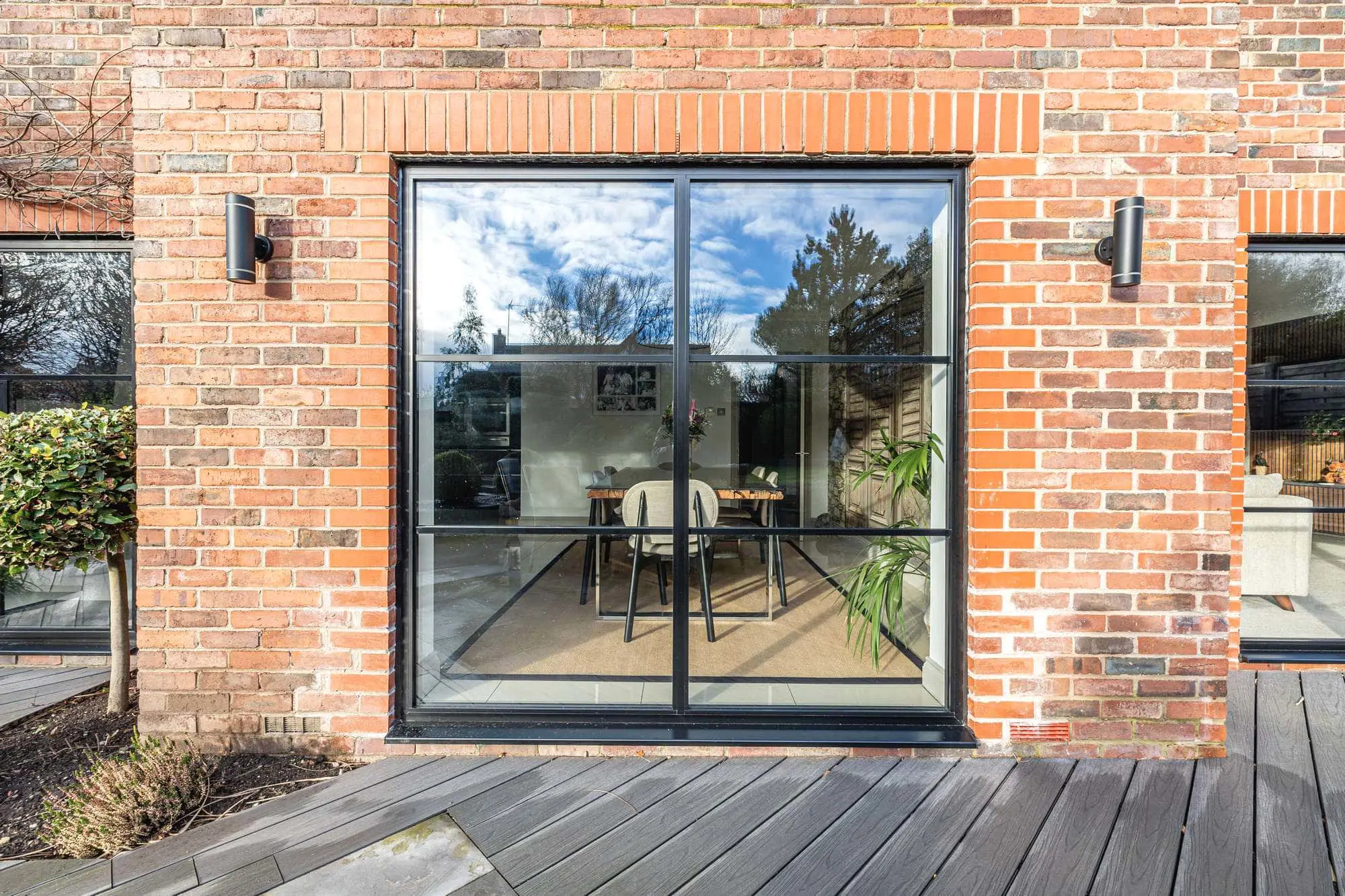 Black aluminium windows with horizontal glazing bars.