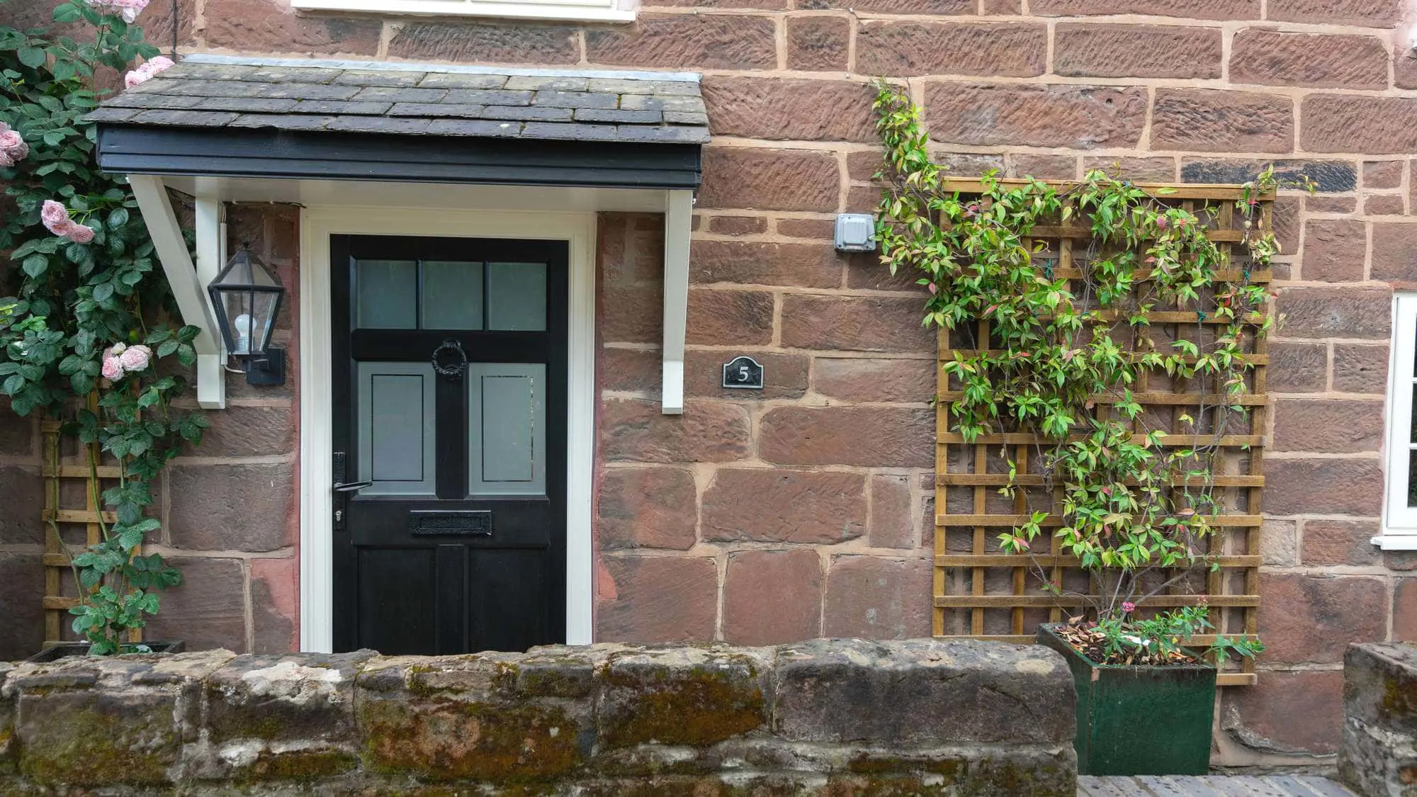 Traditional entrance door design to mimic timber.