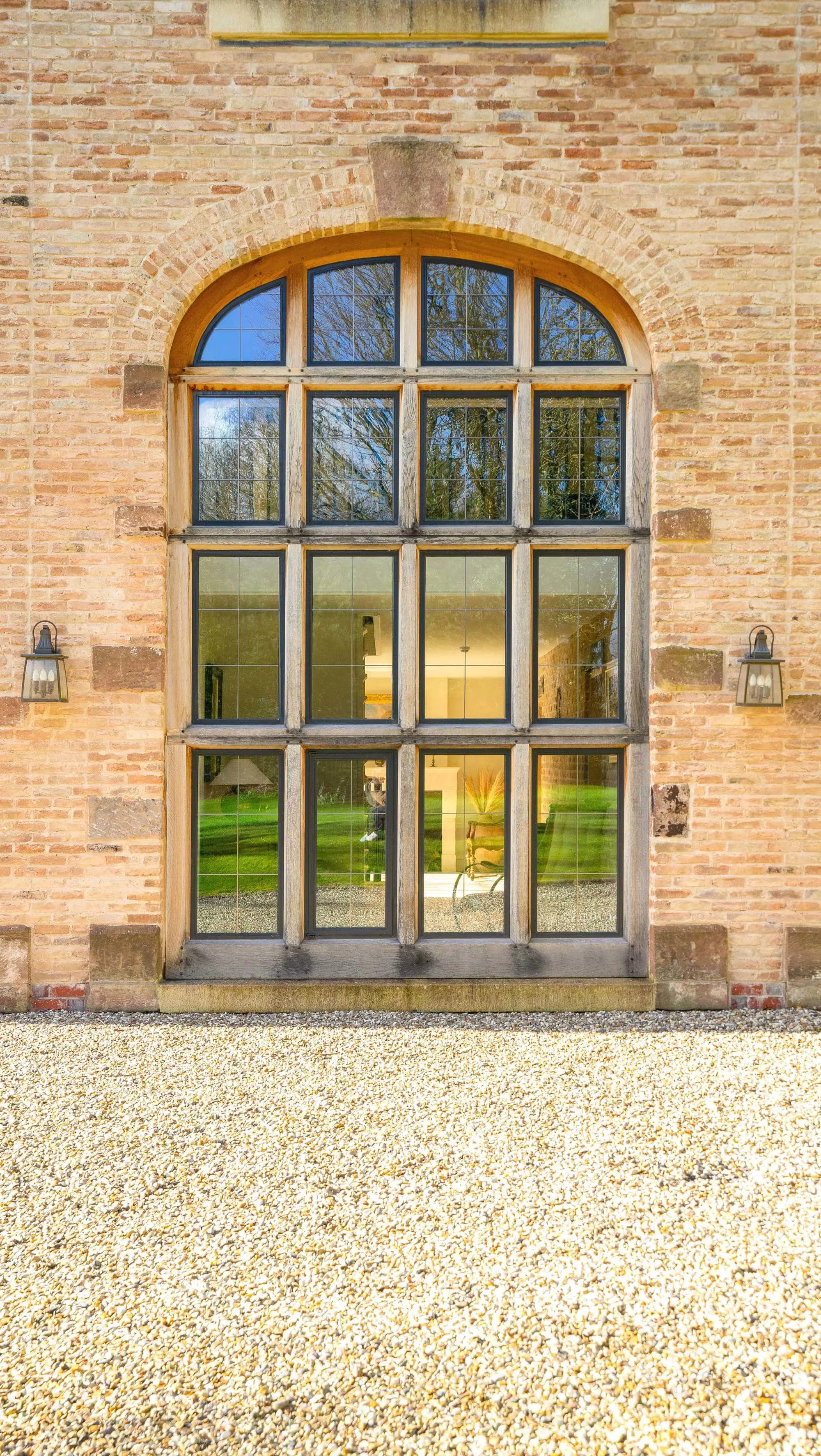 External view of the oak frame steel windows with lead lighting.