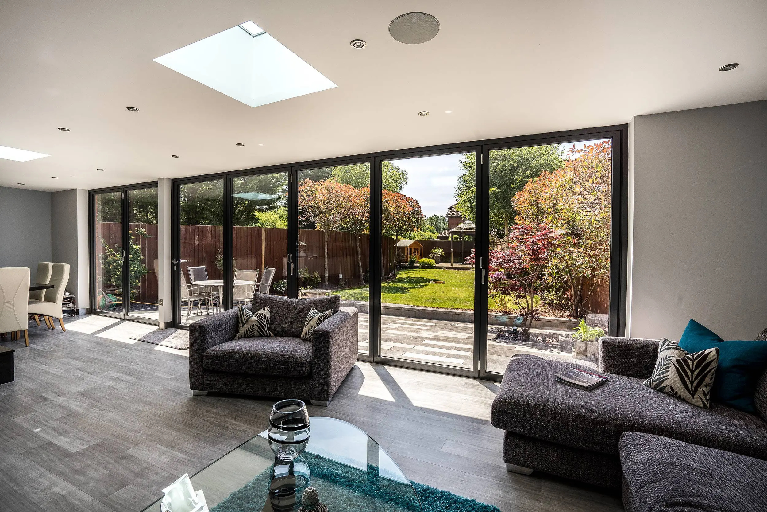 Internal shot showing roof lights and aluminium bifold doors.