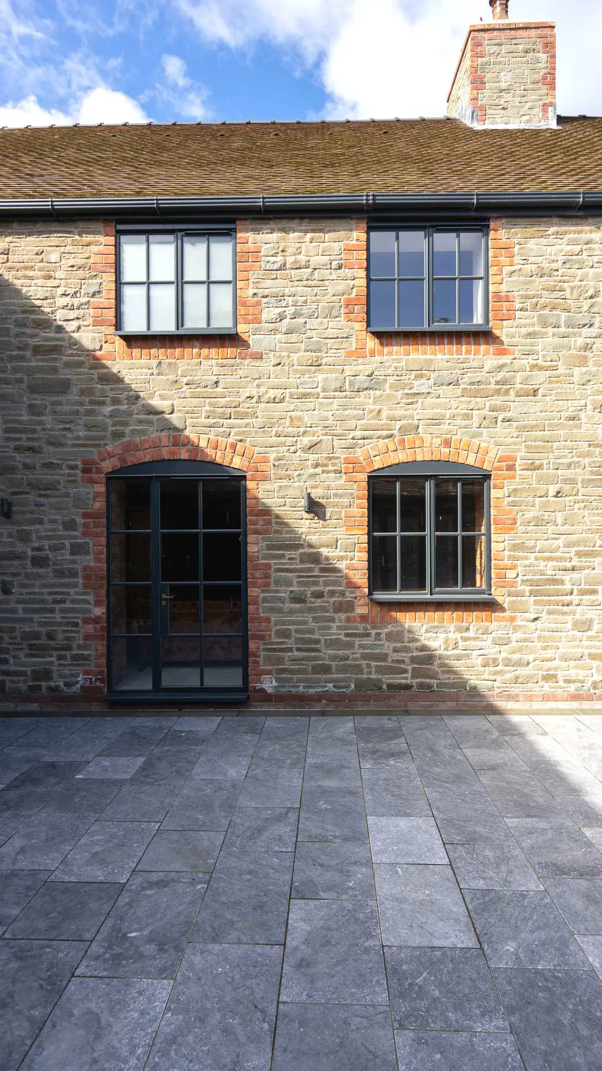 Crittall windows and doors installed throughout a large section of the barn conversion.