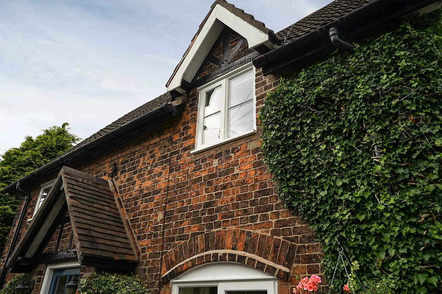 External shot of this stunning cottage showing timber windows from our very own Knight Collection and timber door.