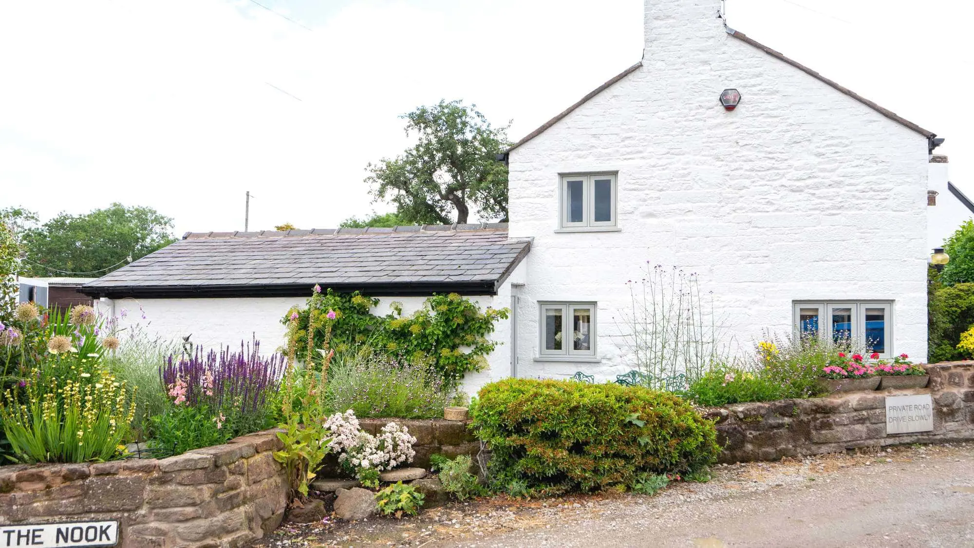 Side view of Christmas Cottage with a new timber alternative flush window installation.