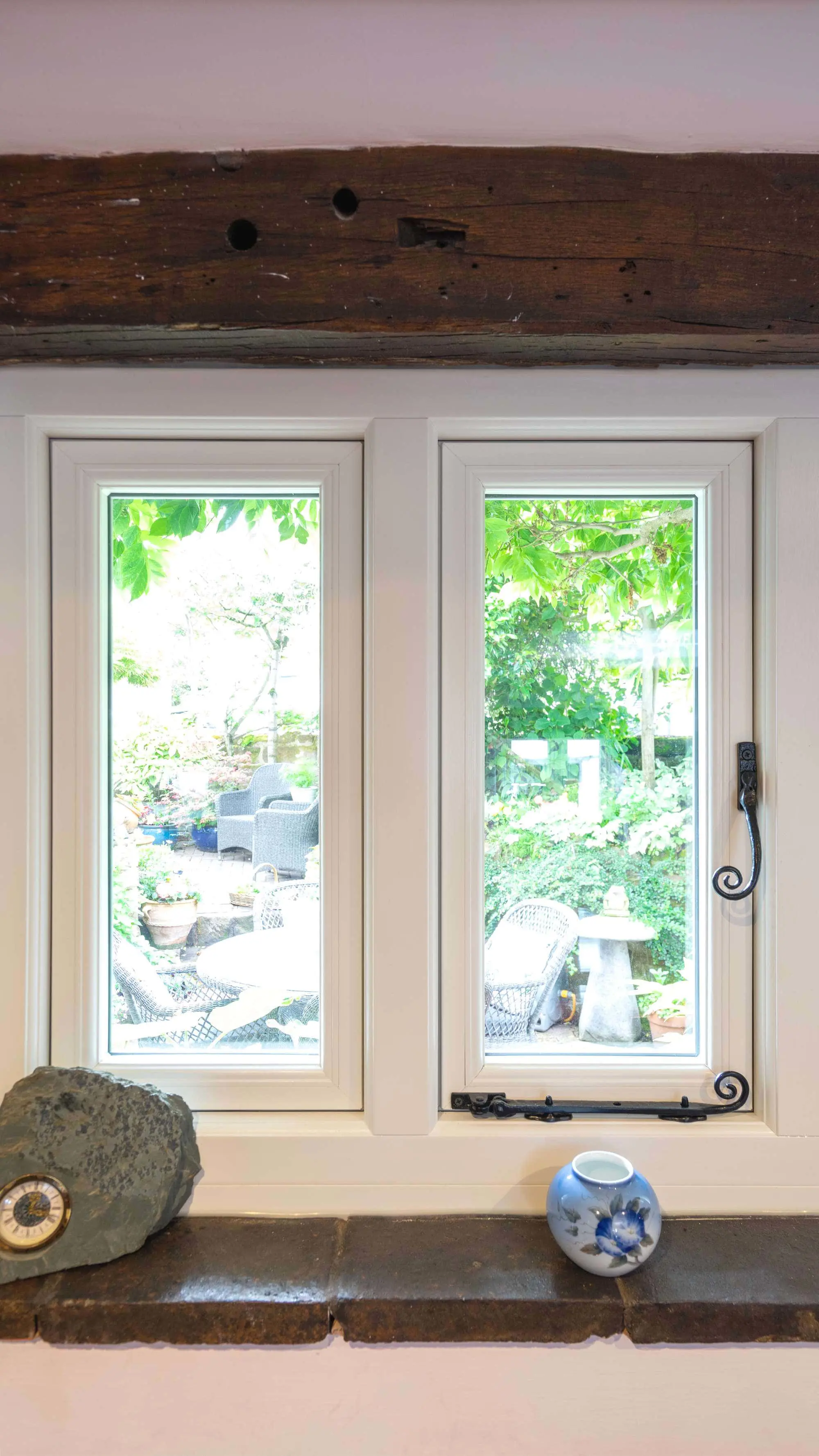 Close up internal view of window with cast iron hardware.