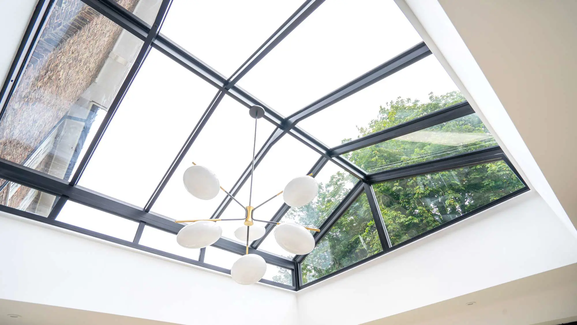 Bespoke pitched roof lantern with vertical glazing.