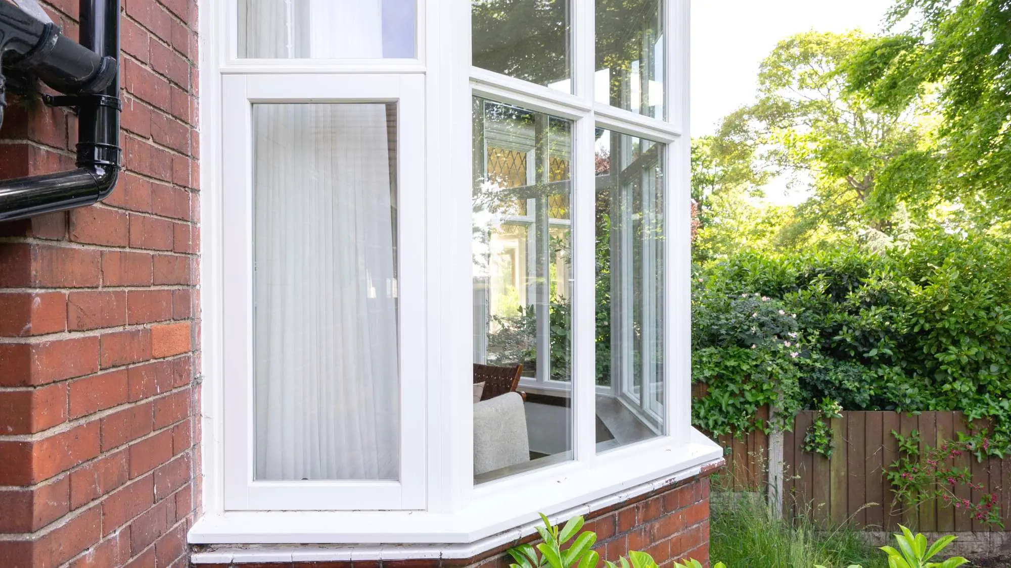 Close up of opener on timber bay window, external view.