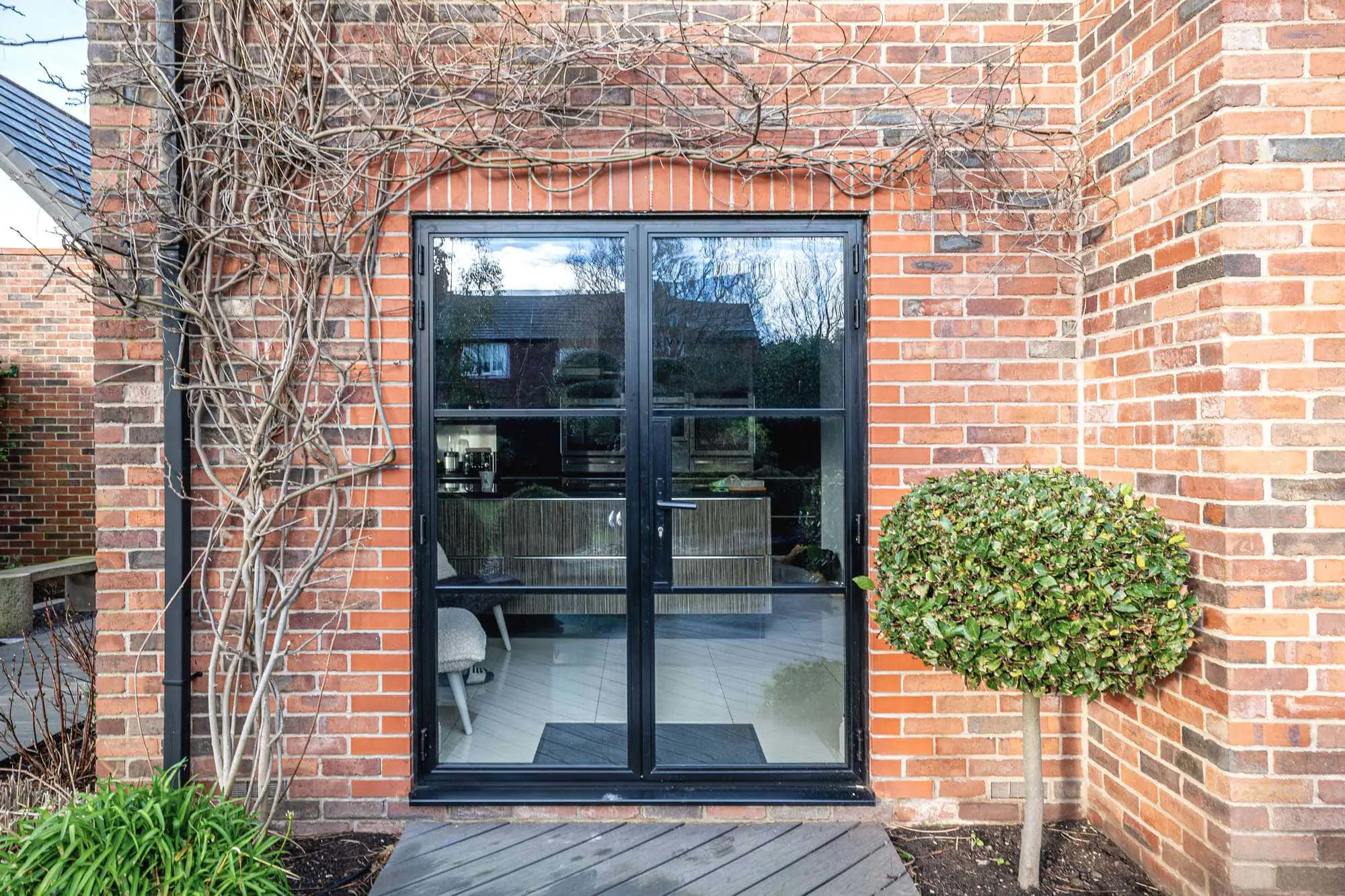 External view of black aluminium steel alternative doors.