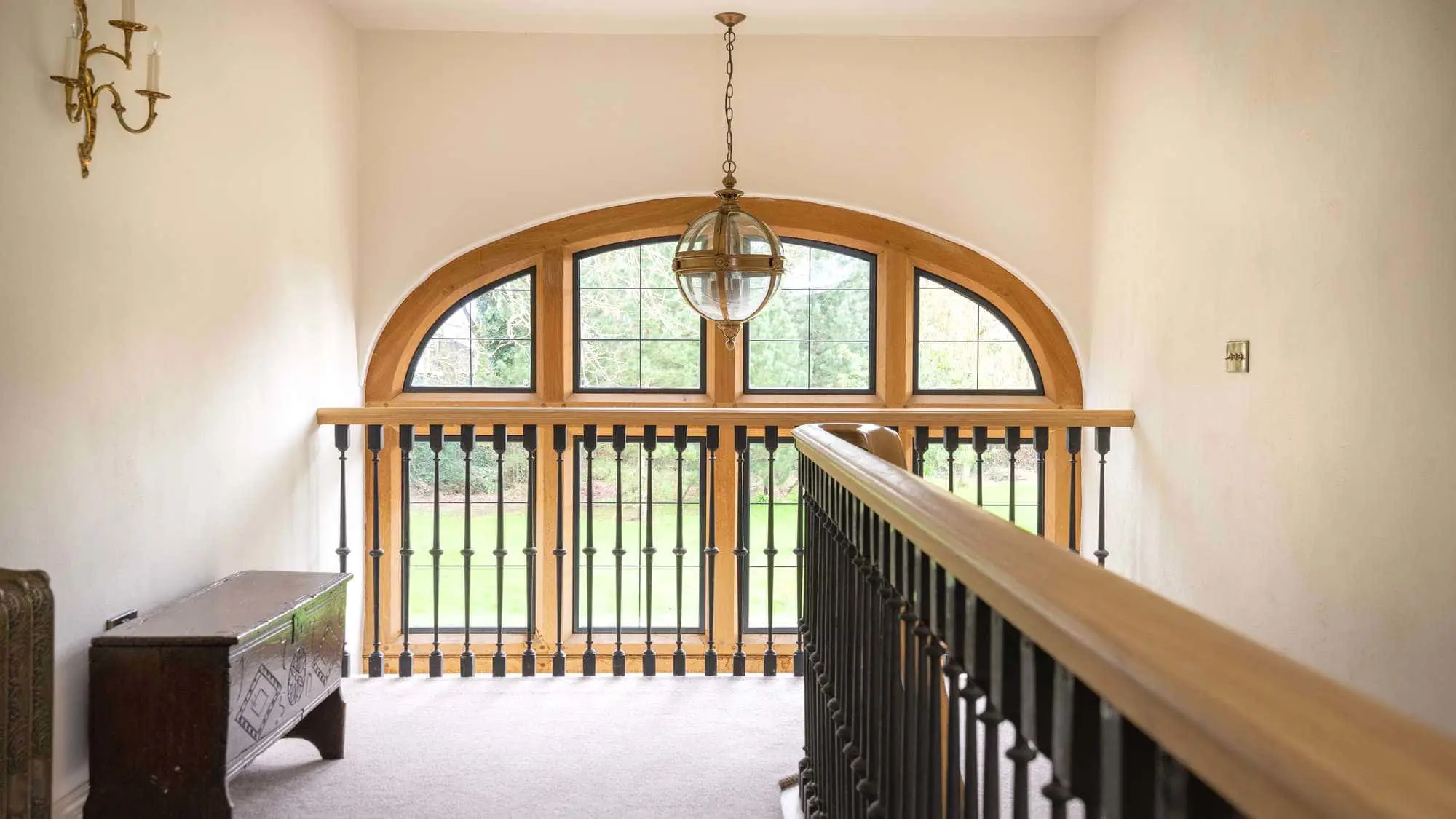 View of the arched timber frame window internally from the first floor.